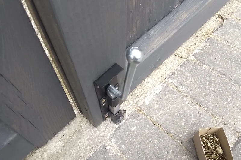 Gate shoot bolt fitted at base of driveway gate — Mitchell Hunter Handyman, Tankerton | mitchhandyman.co.uk