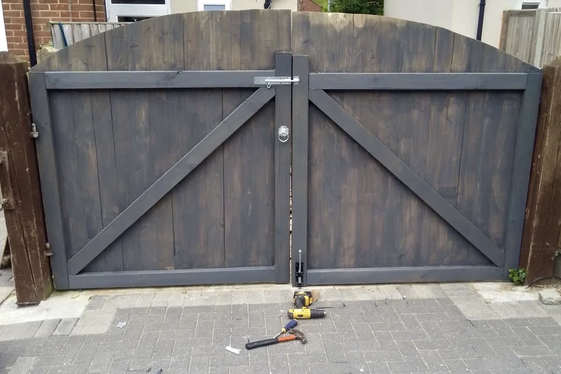 Double wooden driveway gates installed and bolted — handyman Tankerton | mitchhandyman.co.uk