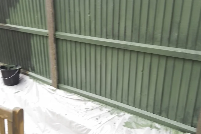 Garden fence panels freshly painted in dark green — Mitchell Hunter Handyman, Swalecliffe | mitchhandyman.co.uk