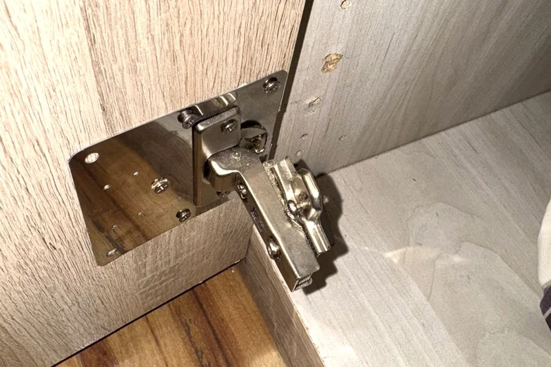 Soft-close cabinet hinge fitted on flat-pack furniture — Mitchell Hunter Handyman, Whitstable | mitchhandyman.co.uk
