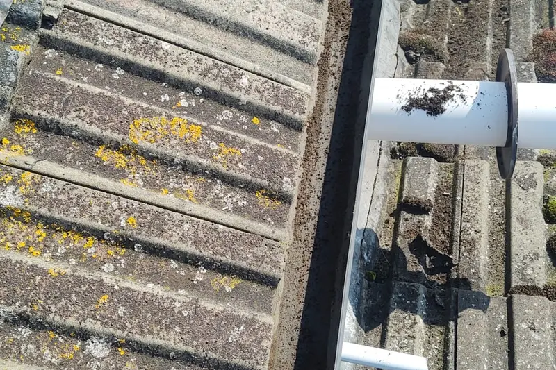 Blocked valley gutter packed with compacted debris before cleaning — Mitchell Hunter Handyman, Herne Bay | mitchhandyman.co.uk