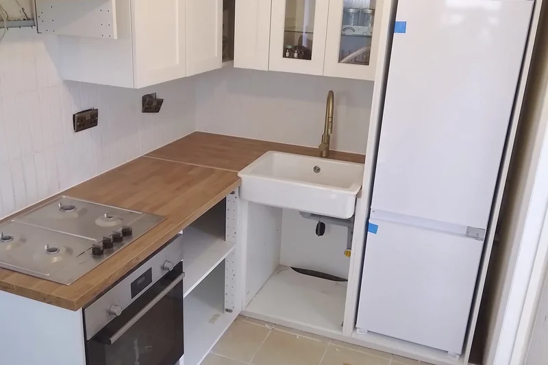 Completed kitchen installation with white shaker units and Belfast sink — Mitchell Hunter Handyman, Seasalter | mitchhandyman.co.uk