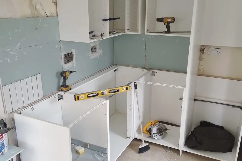 Kitchen carcasses being positioned and levelled — Mitchell Hunter Handyman, Seasalter | mitchhandyman.co.uk