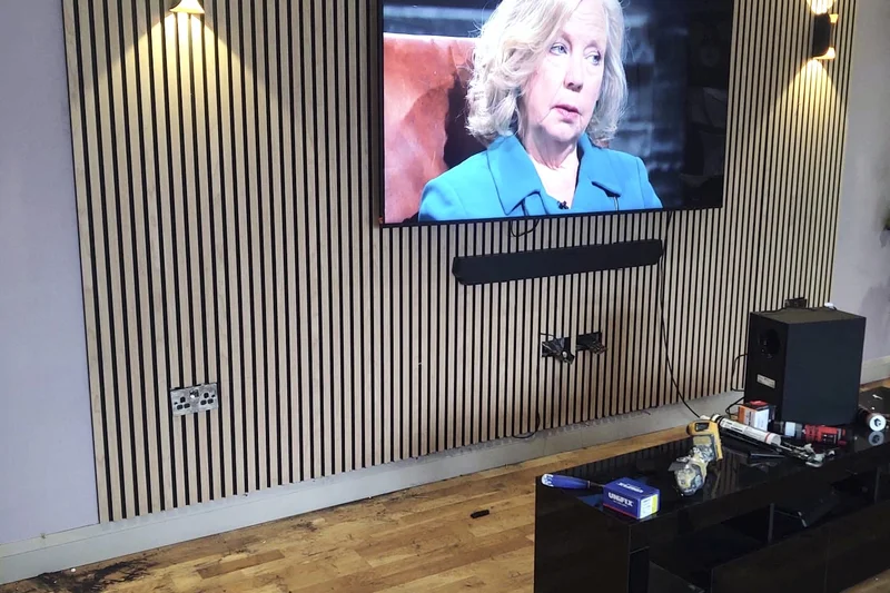 Slatted feature wall with TV mounted and wall lights fitted — handyman Herne Bay | mitchhandyman.co.uk