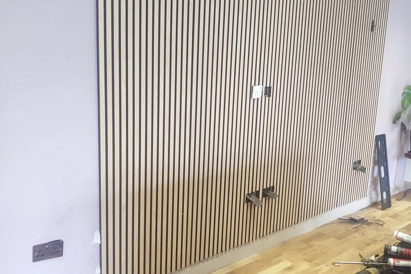 Decorative slatted feature wall being installed — Mitchell Hunter Handyman, Herne Bay | mitchhandyman.co.uk