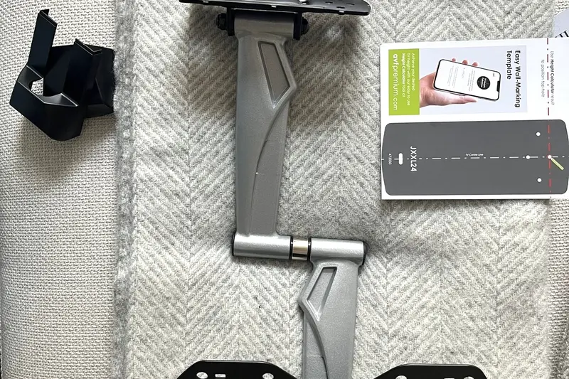 TV wall mount bracket kit laid out before installation — Mitchell Hunter Handyman, Seasalter | mitchhandyman.co.uk